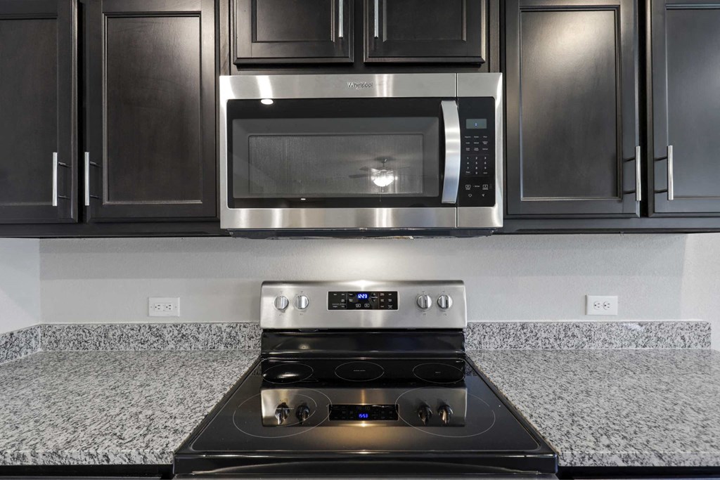 a kitchen with a stove and a microwave