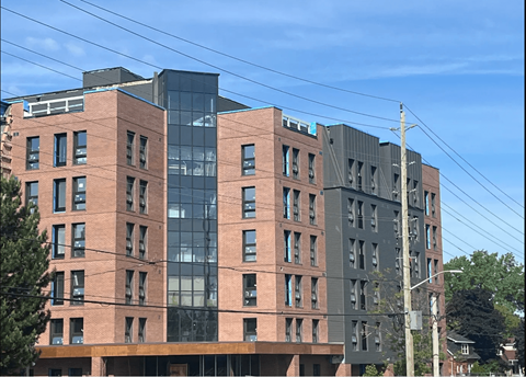 a city building with a blue sky in the background