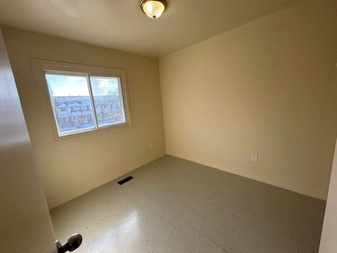 an empty room with a window in it