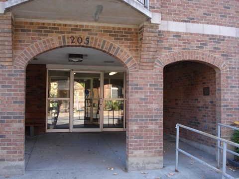 A brick building with the number 205 on it.
