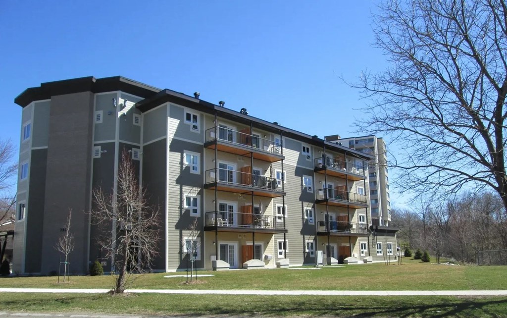 an apartment building with balconies on a sunny day