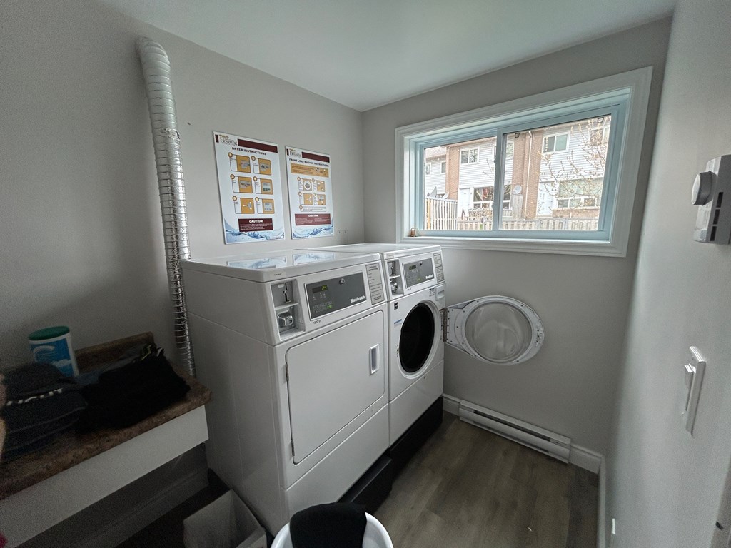A laundry room with a washer and dryer.
