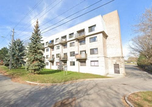 a large white building on the side of a street