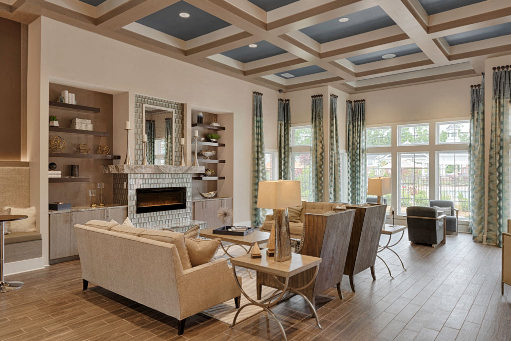 a living room with couches and chairs and a fireplace