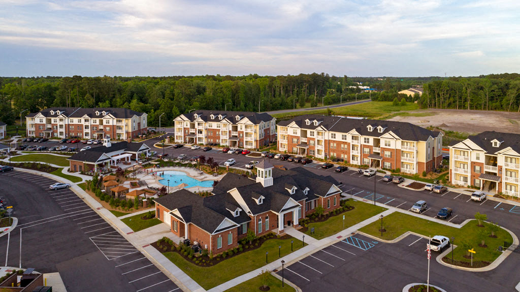 Apartment buildings and parking lot; community clubhouse and pool