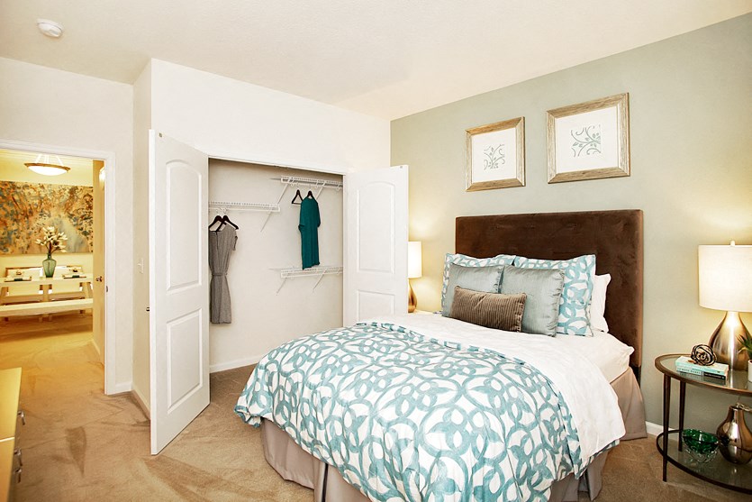 Bedroom with closet and carpet; hallway bathroom