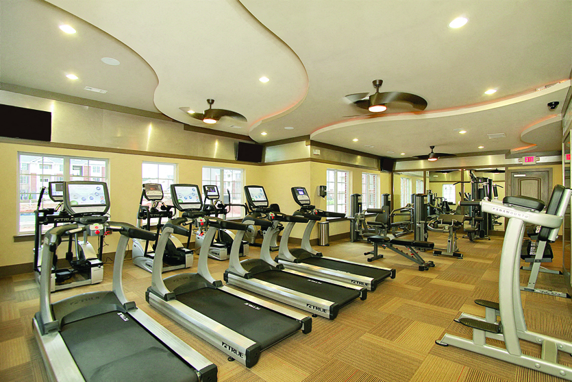 Fitness center with cardio equipment; flat screen TV