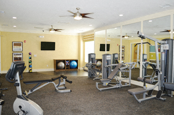 24-Hour Fitness Center with Cardio Machines and Yoga Area