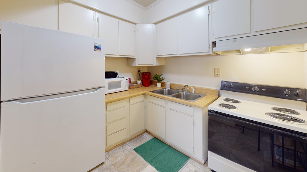 Kitchen a full-size kitchen with a refrigerator