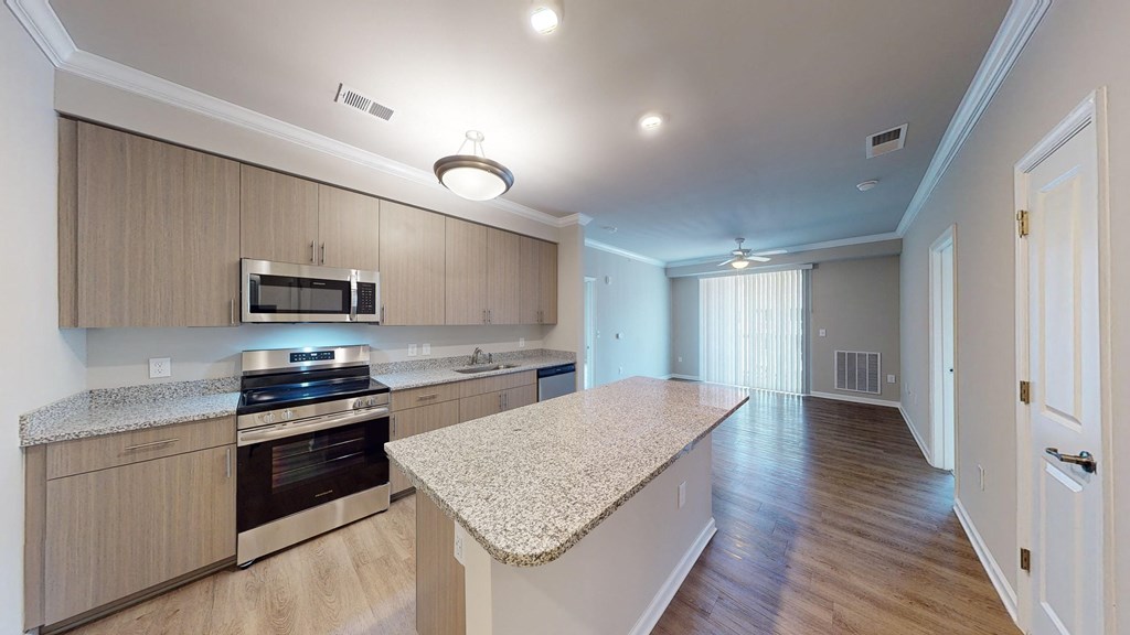 a kitchen with a marble counter top and