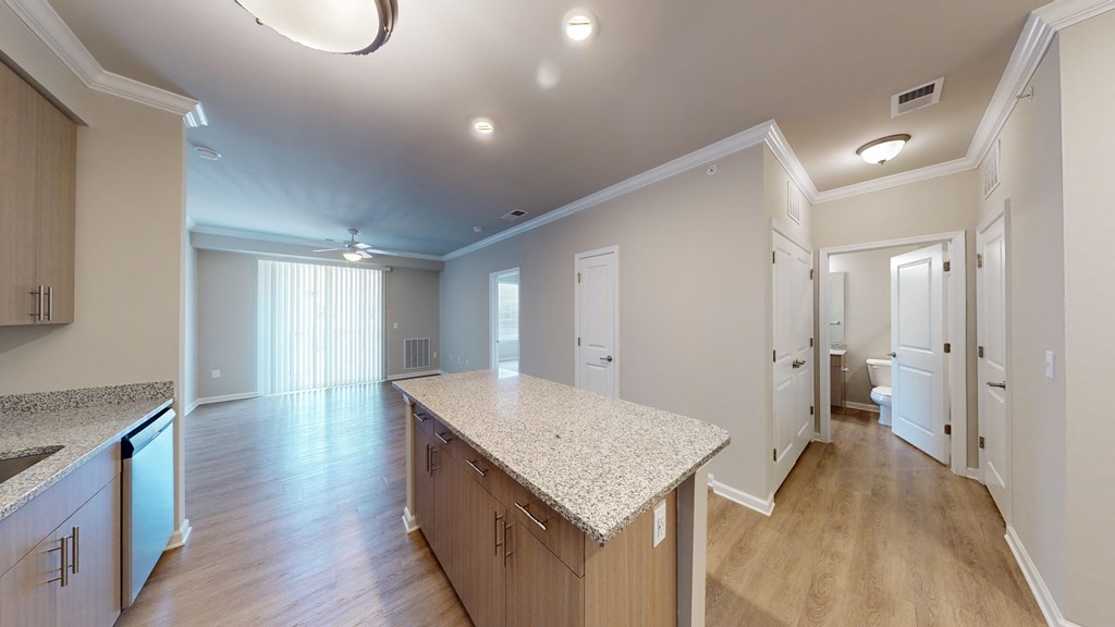 a kitchen with a marble counter top in a new home