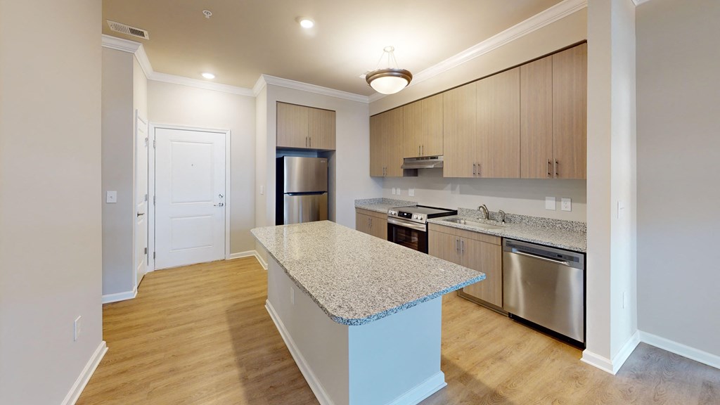 a kitchen with stainless steel appliances and granite counter tops