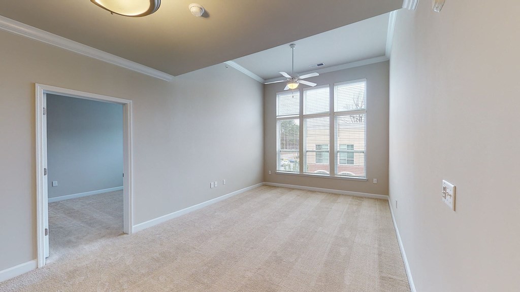 Living room and sunroom with ceiling fan