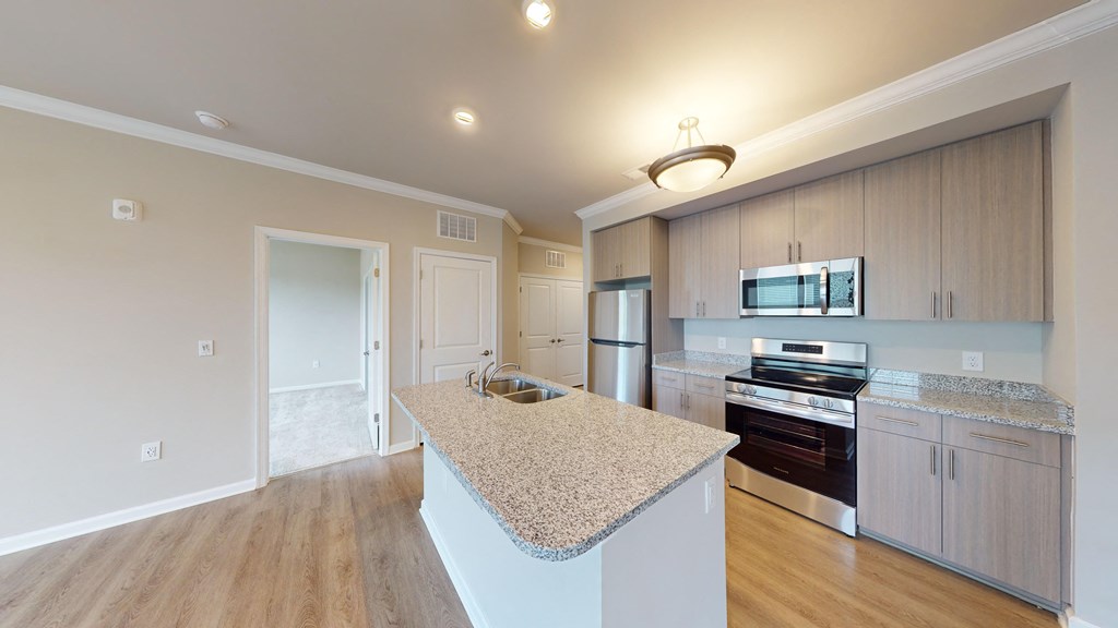 a kitchen with granite counter tops and stainless steel appliances
