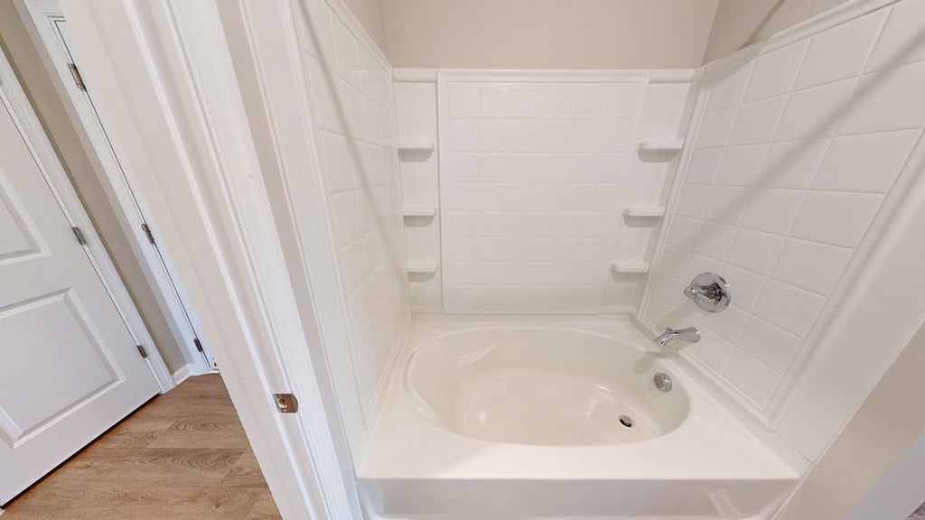 a small bathroom with a sink and a shower