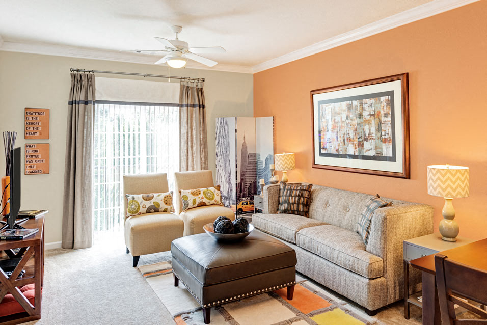 Living room with ceiling fan; sliding door