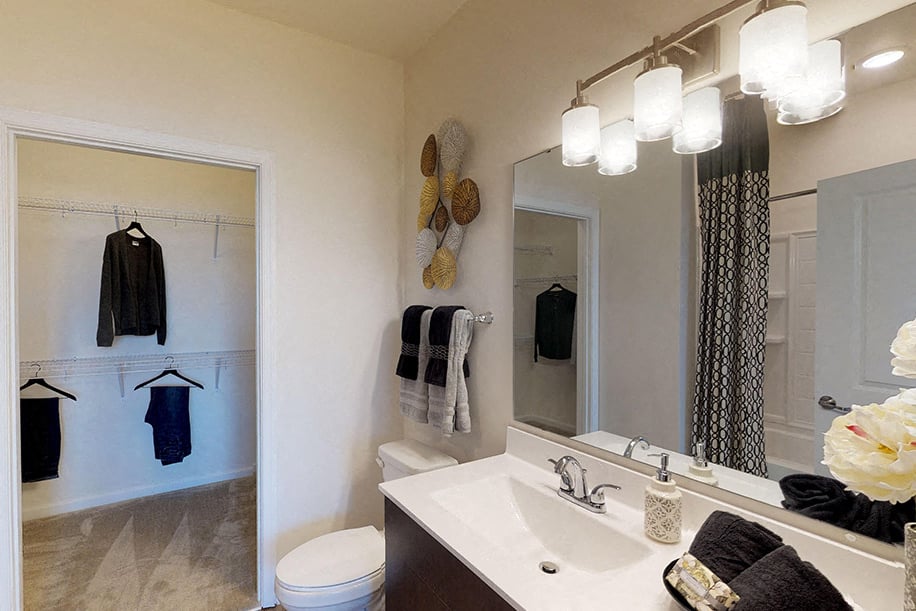 Bathroom leading into large closet