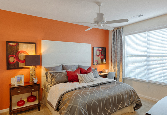 Bedroom with ceiling fan, carpet and window