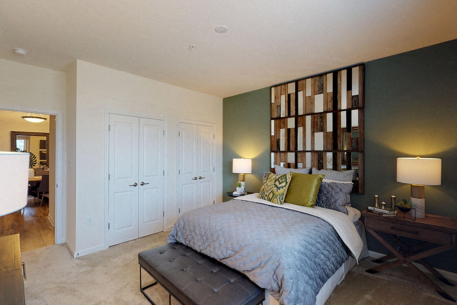 Bedroom with closets; hallway bathroom