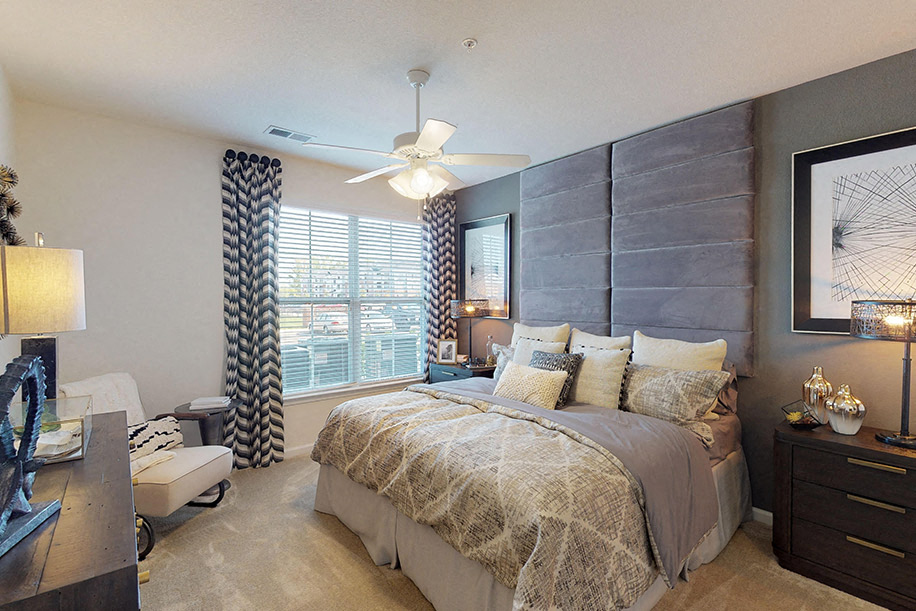 Bedroom with ceiling fan and window