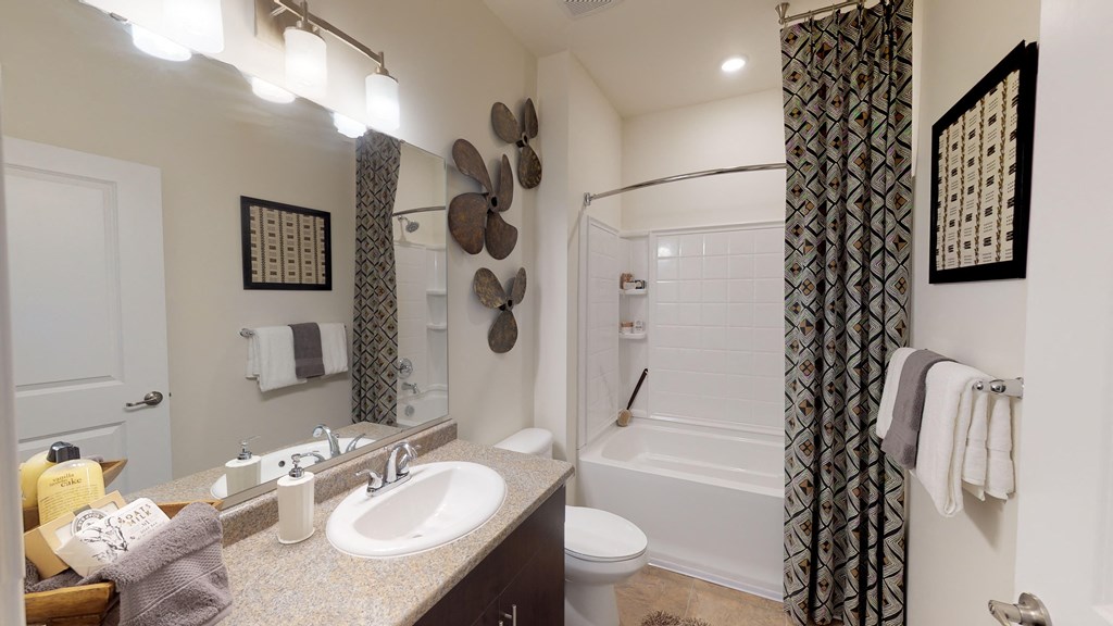 Bathroom with sink, toilet, shower and tub