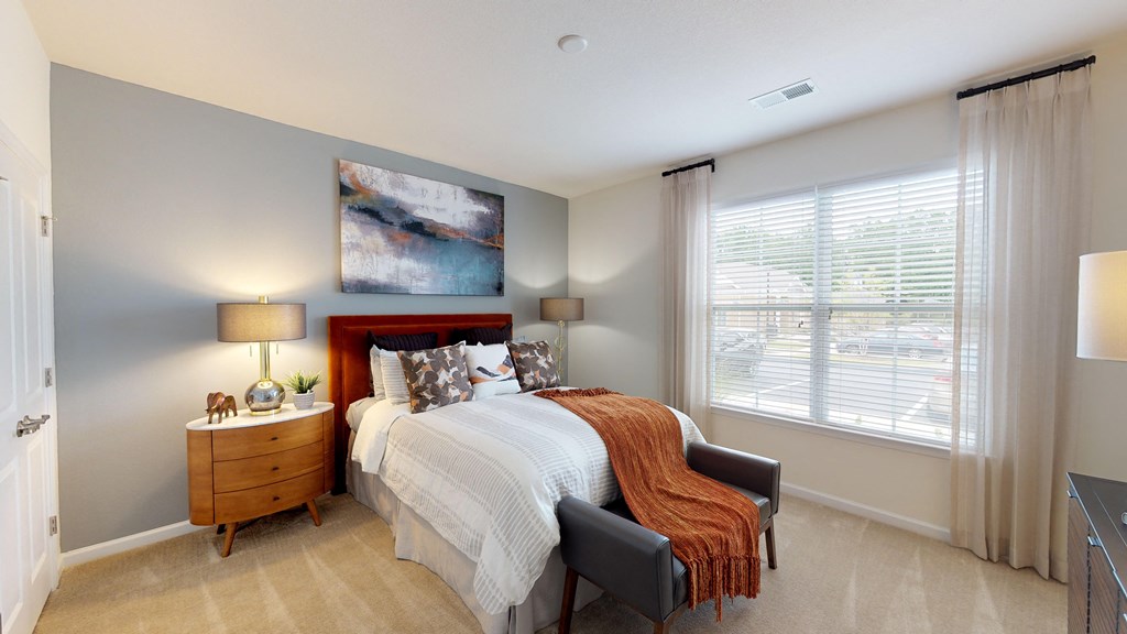 Bedroom with window; carpet