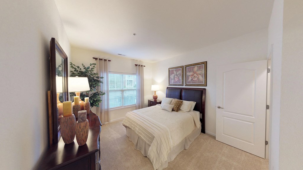 Bedroom with window; carpet