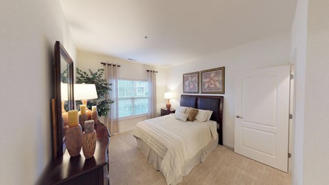 Bedroom with window; carpet