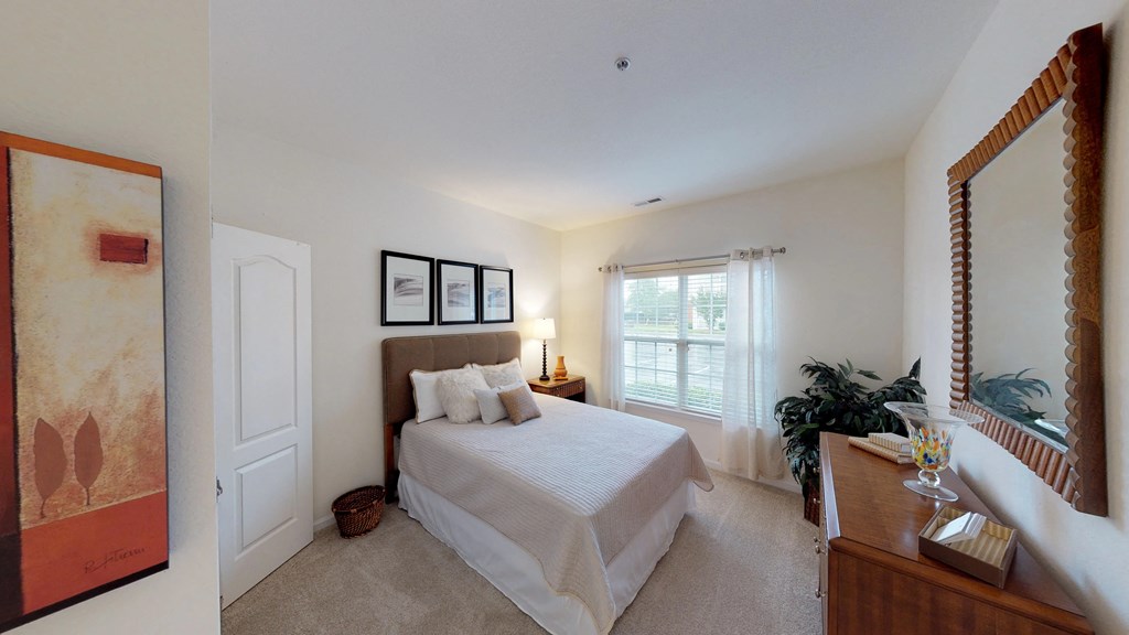 Bedroom with window; carpet