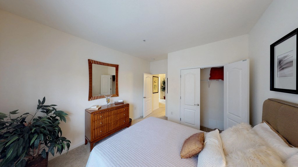 Bedroom with closet; hallway bathroom