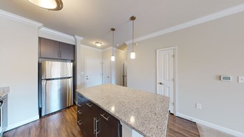 Kitchen with island, dark cabinets, vinyl floors and granite countertops - Photo Gallery 46