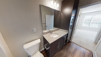Bathroom with sink, toilet and storage cabinet - Photo Gallery 51
