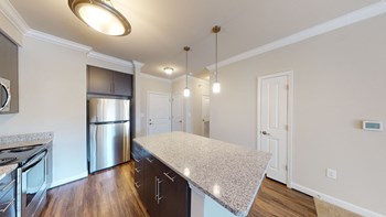 Kitchen with island, dark cabinets, vinyl floors and granite countertops - Photo Gallery 54
