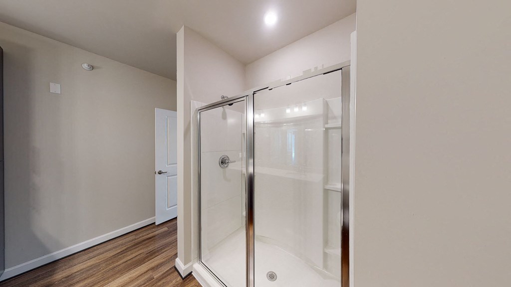 Bathroom with shower and vinyl floors