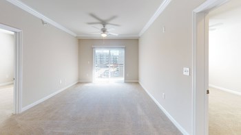 Living room with carpet; ceiling fan; door to patio - Photo Gallery 55