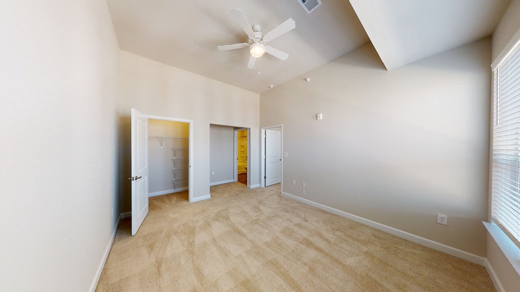 Bedroom with carpet, closet, ceiling fan