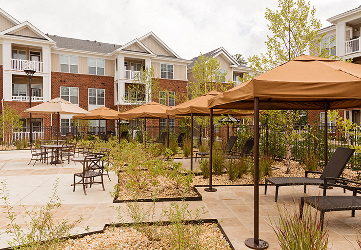 Chairs and umbrellas around pool