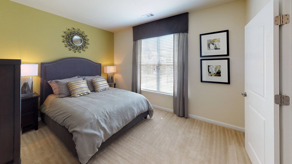 Bedroom with window; carpet