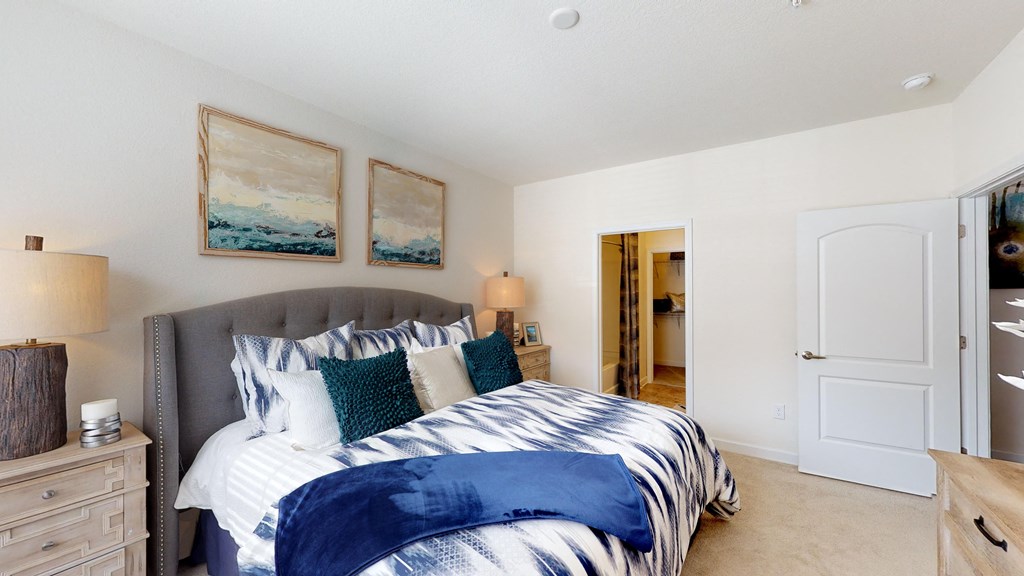 Bedroom with private bathroom and walk-in closet