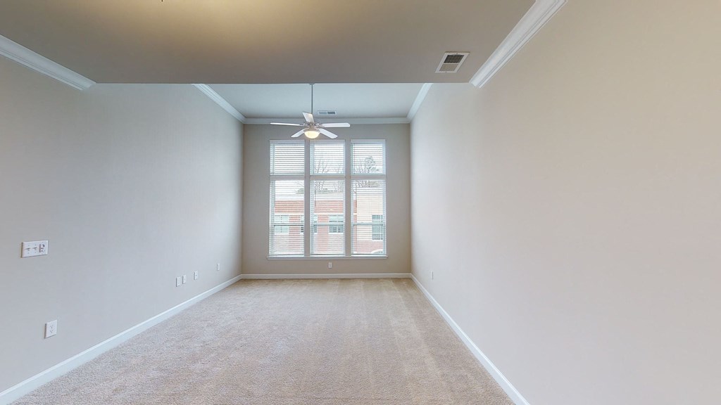 Living room and sunroom with ceiling fan