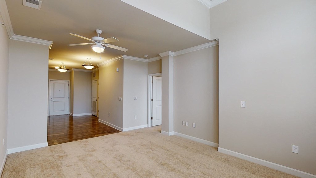 Living room and sunroom with ceiling fan