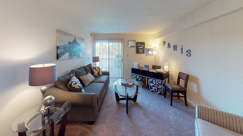 a living room with a couch and a table