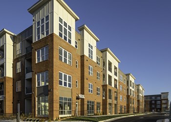 Exterior Exterior of four-story building with retail space available on the first floor