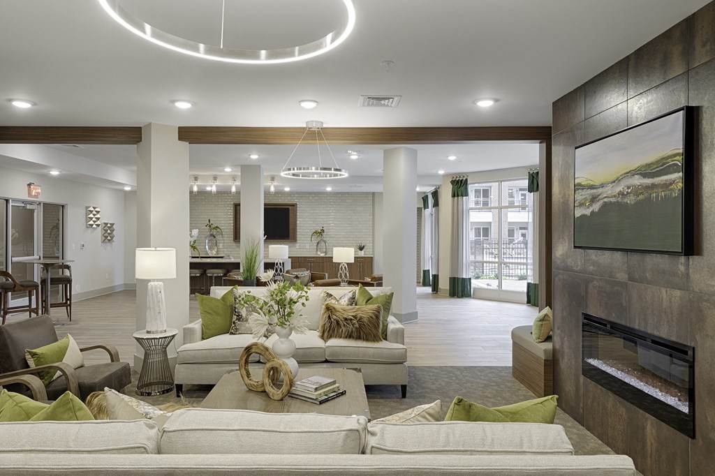 Clubhouse with seating and fireplace; flat screen TV