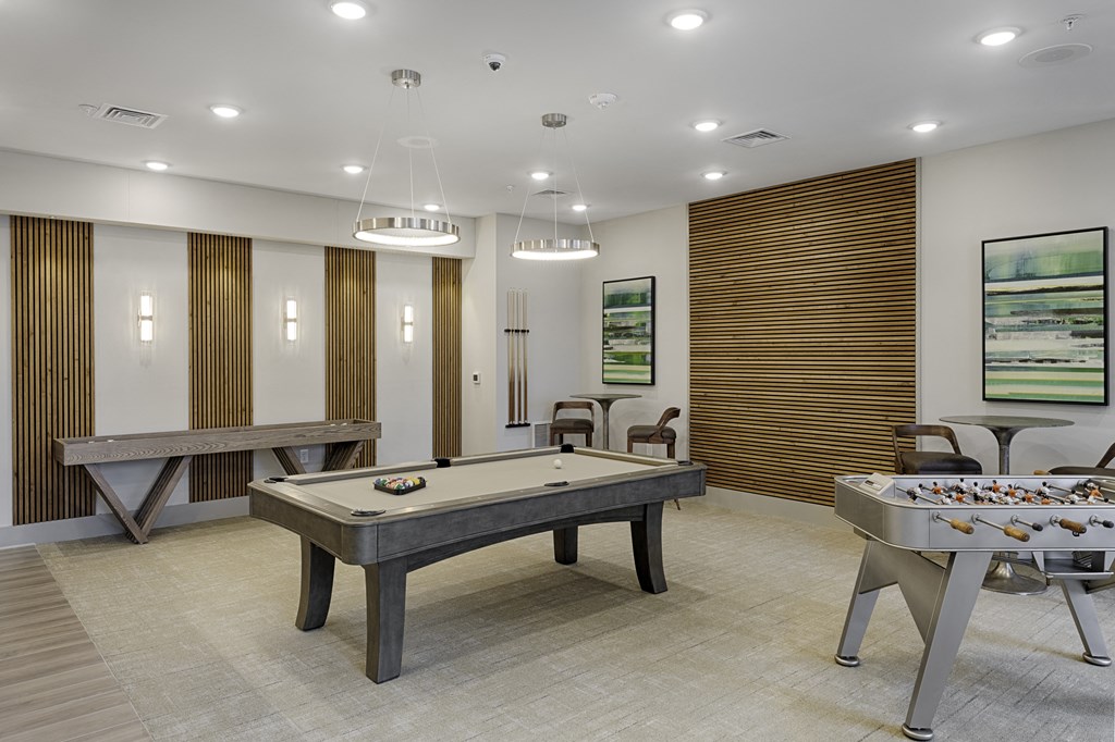 Game room with foosball table, billiards, shuffleboard, flat screen TV