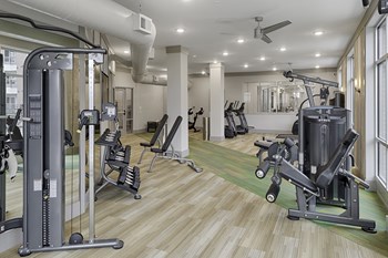 Fitness center with cardio and resistance training equipment; free weights - Photo Gallery 17