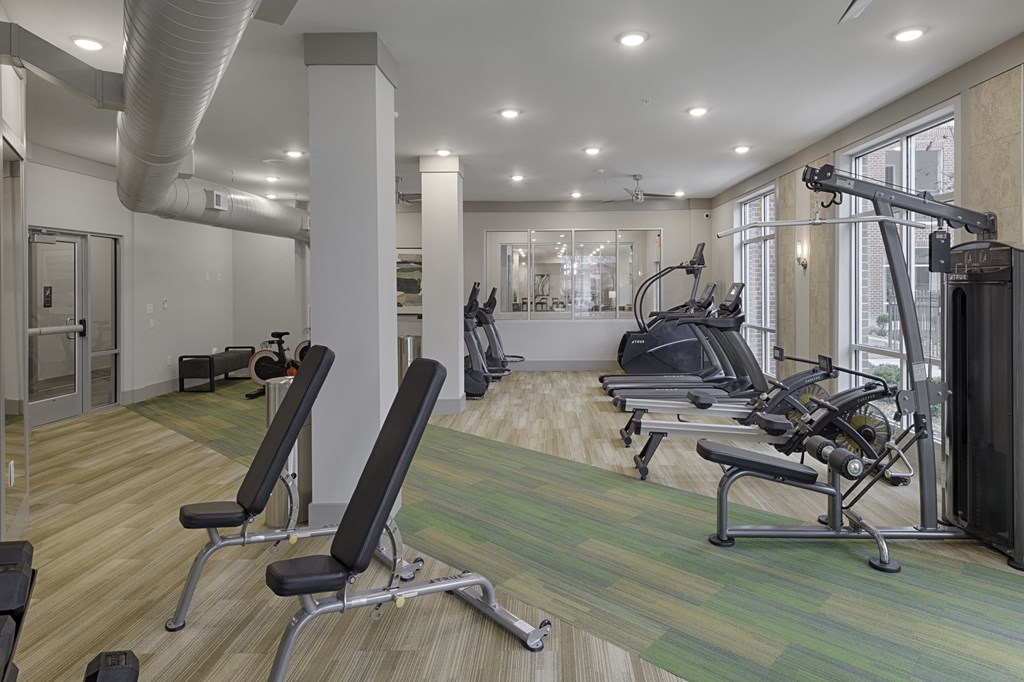 Fitness center with cardio and resistance training equipment; free weights