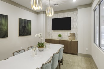 Conference and meeting room inclubhouse with long table, chairs and TV - Photo Gallery 21
