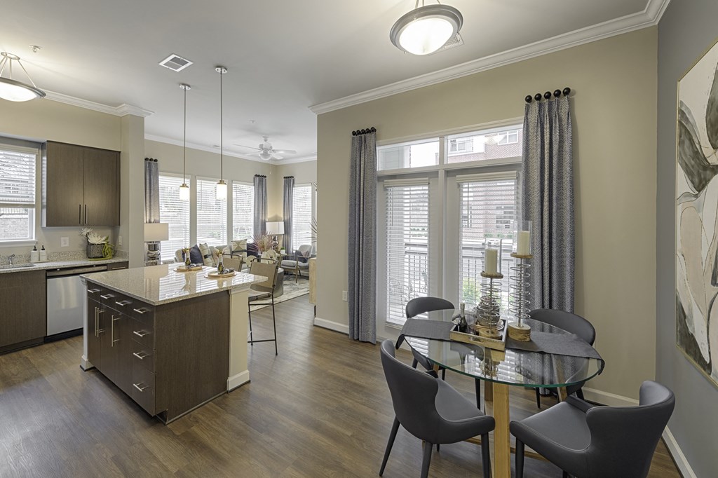 Dining area open to kitchen; door to patio or balcony