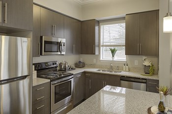 Kitchen with island, dark cabinets, vinyl floors and granite countertops - Photo Gallery 27